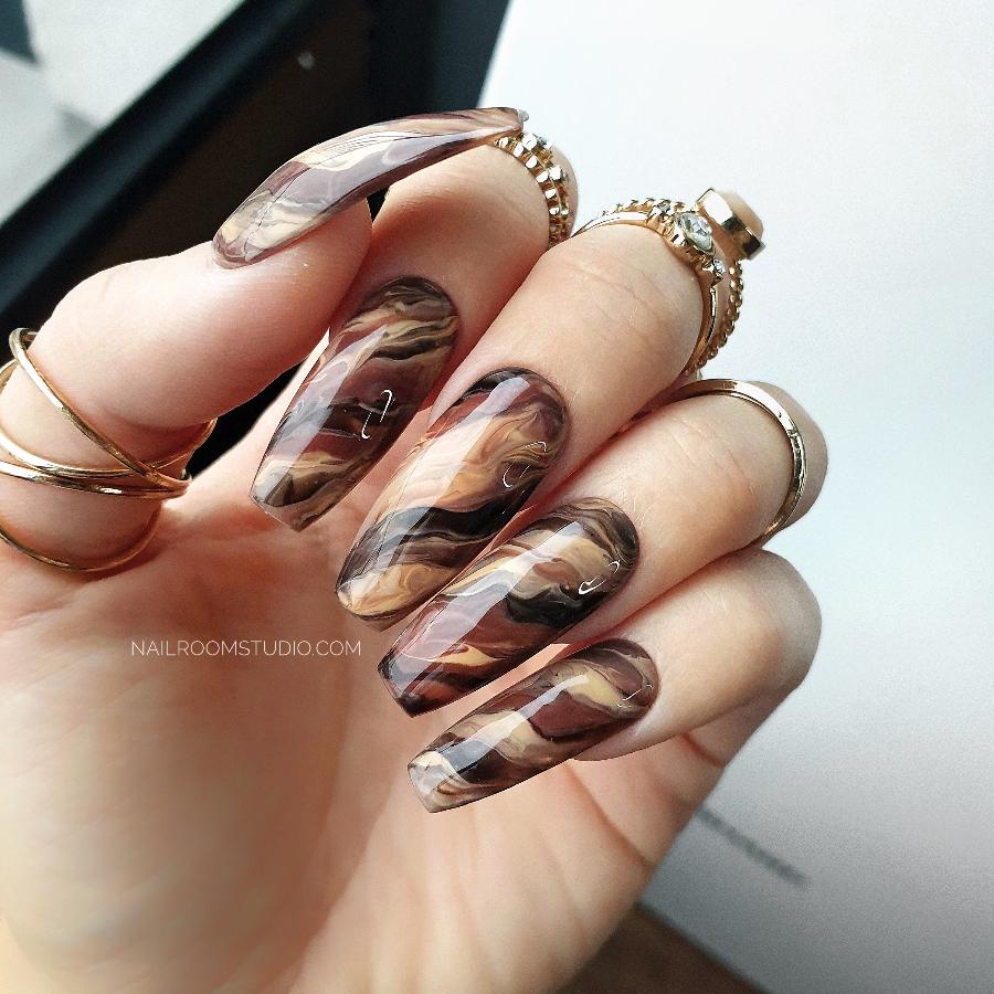 Beige and brown marbled autumn nails with hand-painted water painting design, perfect for fall, available in long, medium, or short shapes, ideal for dark skin tones by Nail Room Studio