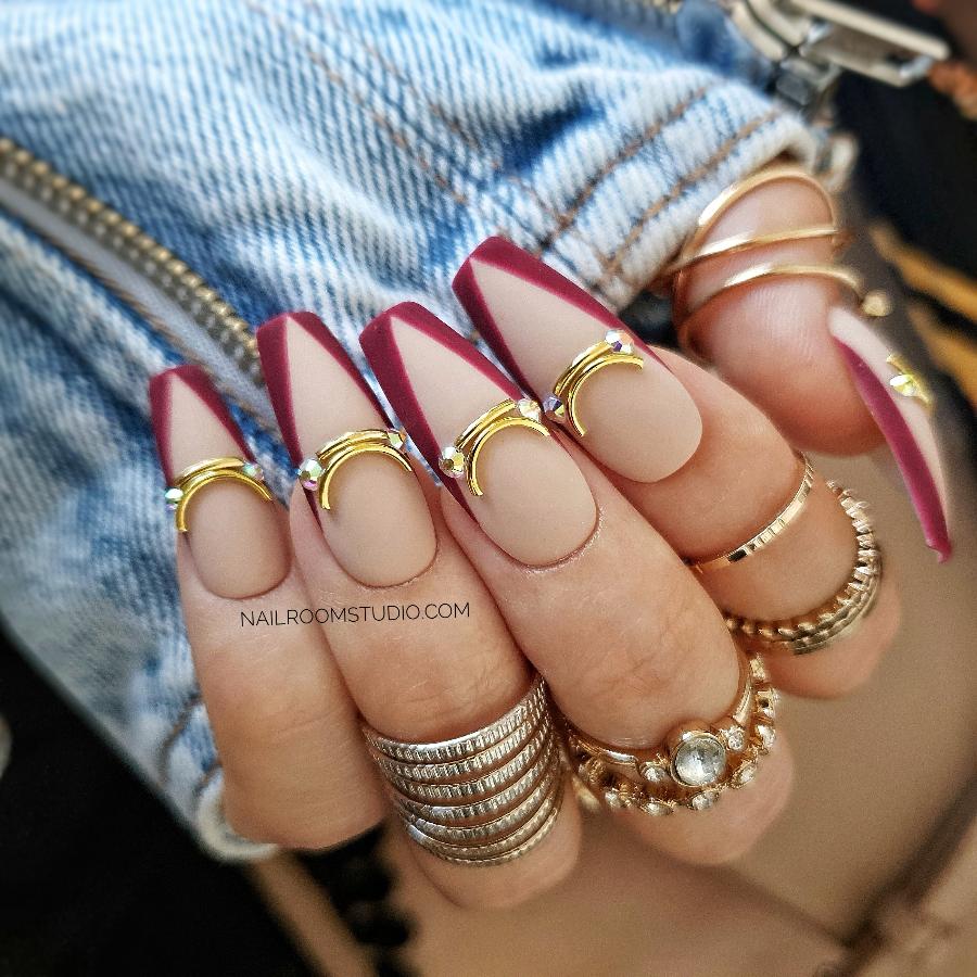 Sophisticated matte nude nails featuring a deep burgundy French design, perfect for a classic yet bold style by Nail Room Studio