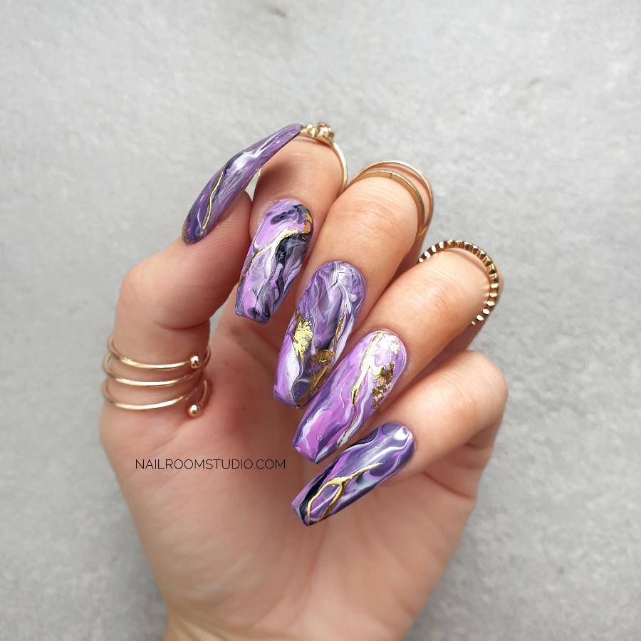 Lilac, purple, and pink long coffin press-on nails with custom hand-painted marble patterns, perfect for both toes and hands, offering a one-of-a-kind, elegant style
