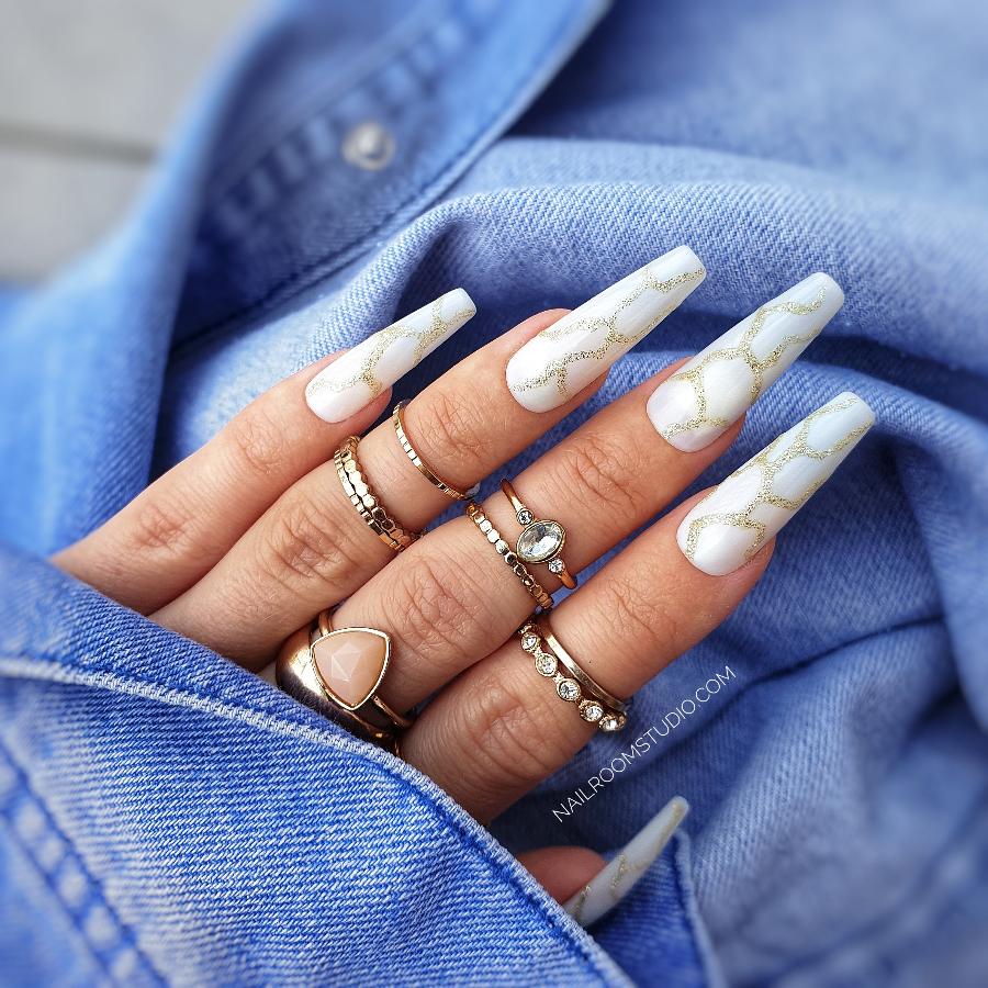 Nail Room Studio white marble nails with gold glitter accents, perfect for an elegant and luxurious design, ideal for matching manicure and pedicure sets, available for both hands and feet