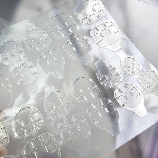 Strong adhesive tabs for secure application of Press-On Nails, designed for easy use and removal without damaging natural nails