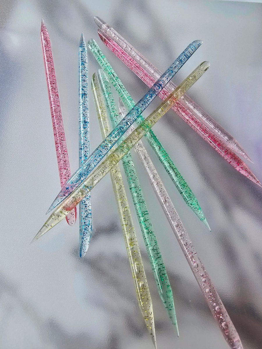 Glittery boundle cuticle pushers available in multiple colors, perfect for adding a touch of sparkle to your nail care routine