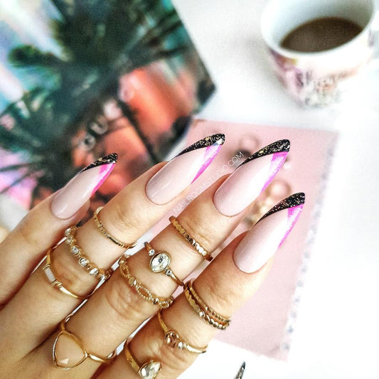 Long beige French nails with unique pink and black geometry on the tips and a touch of glitter