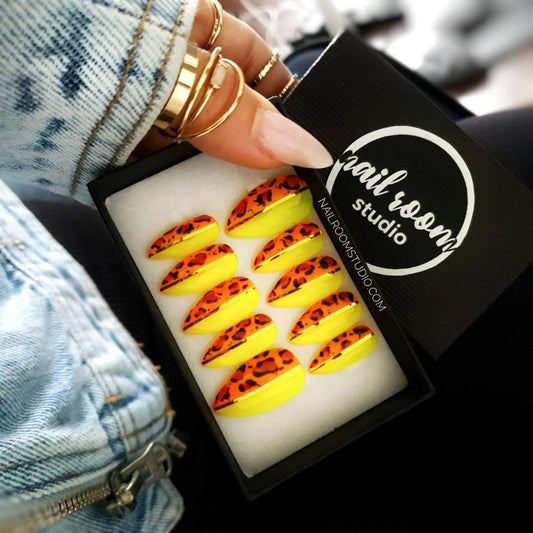 Glossy and glazed press-on nails in a peachy beige color with a fancy transparent French tip. Standard almond length, acrylic nails made to order, available in all sizes, with international shipping