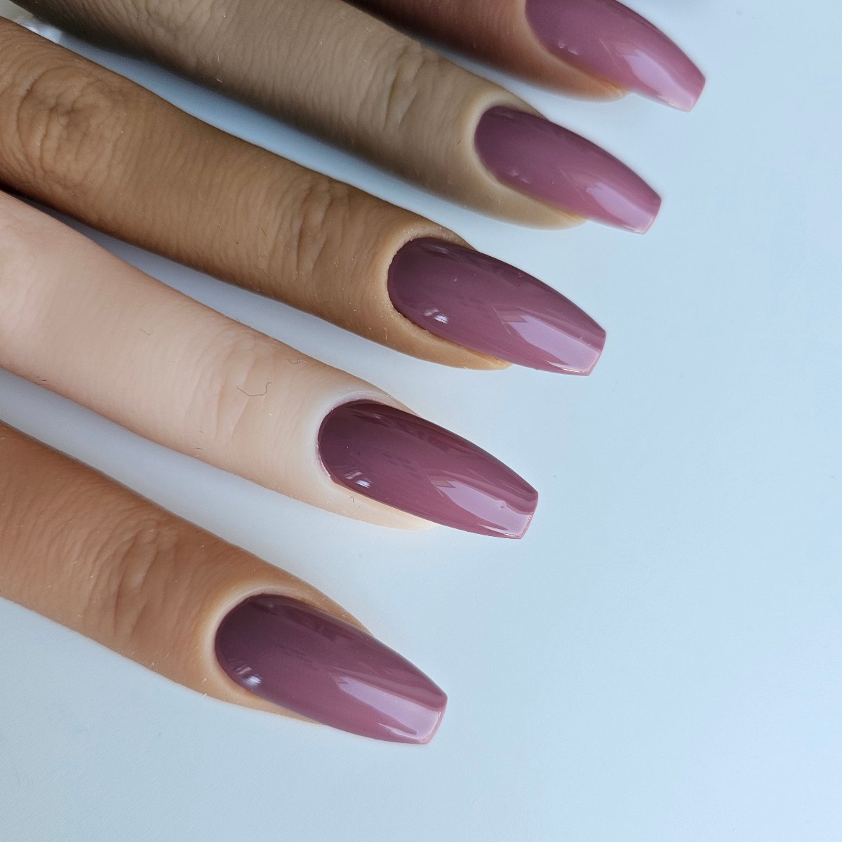 Rich mauve press-on nails, a deep, feminine hue between beige and purple, highly opaque and sophisticated press on nails showed with all skin shades for perfect match