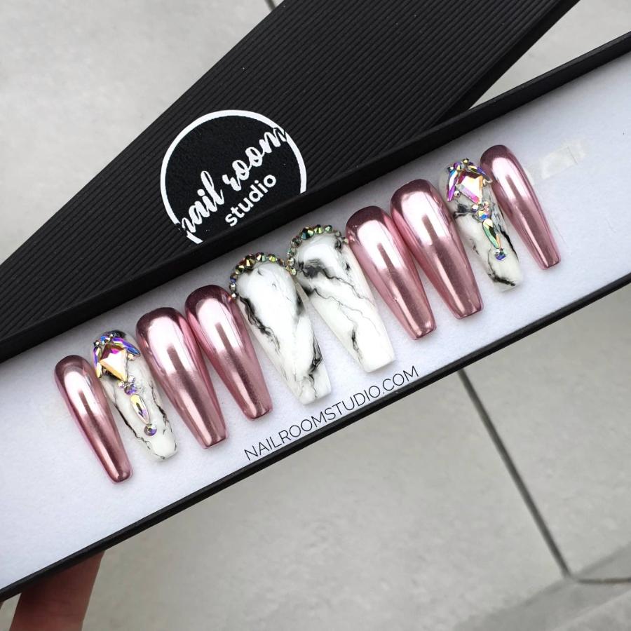 Elegant handmade chrome light pink crylic nails with sparkling crystals, adding a touch of glamour to each nail for a dazzling look