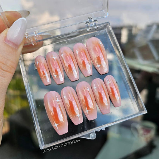 Orange ombre press-on nails with chrome shimmer and a glossy finish, medium coffin shape, size S, packed in a professional box, includes ten nails