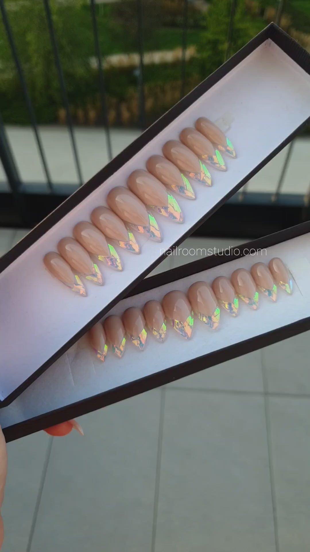 DIY long stiletto nails in nude with transparent broken glass and subtle gold, green, and blue hues by Nail Room Studio