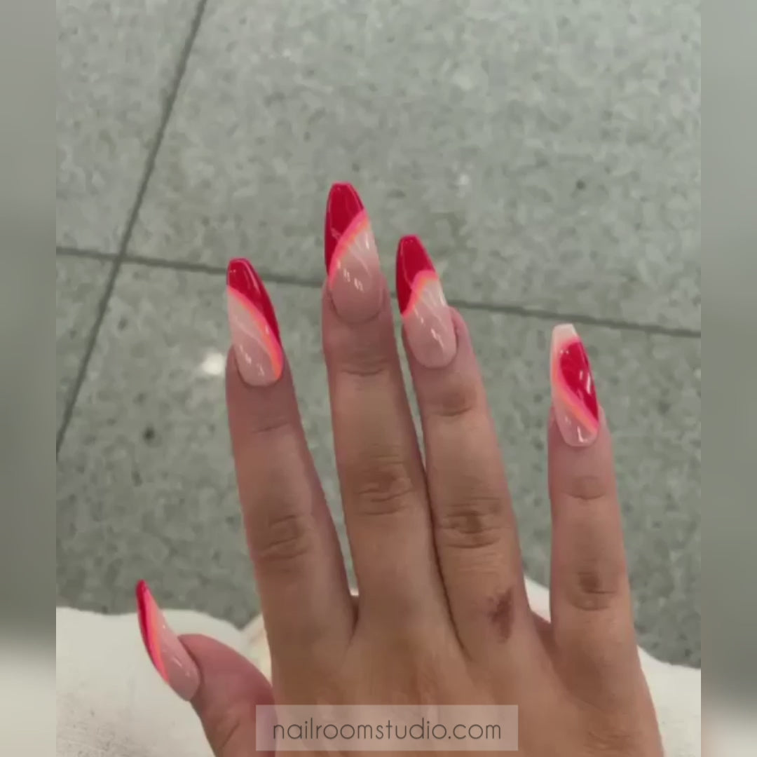Nude and red press-on nails with irregular wave patterns and vibrant Coca-Cola red and orange geometric stripes, perfect for dark or brown skin tones, ideal for both hands and toes