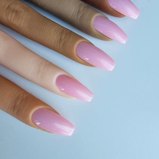 Bright, pearly pink artificial nails with a bubblegum tone, adding a playful, eye-catching look, color skin shade swatches
