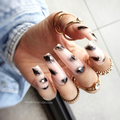 Nail Room Studio pink nude nails with animal print like giraffe and jaguar spots, accented with silver chrome, for both hands and toes, press-on nails salon quality