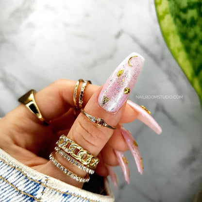 Pink pearl shimmer nails with gold moon, feathers and stars designs, witchy and mystical vibe, perfect for both hands and toes, perfect nails from fairy tale by Nail Room Studio