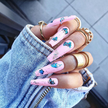 Long sculpted pink nails in a vibrant beach design, complete with silver and blue accents, in a full set of 20 ready to ship from Nail Room Studio