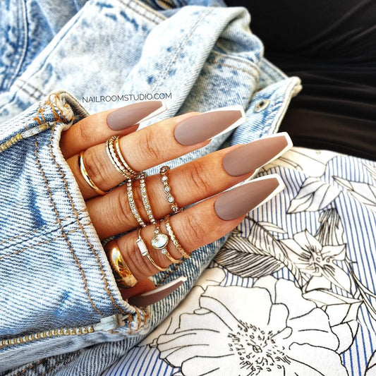 Elegant matte cappuccino nails with a delicate brown French tip, ideal for a stylish and refined appearance by Nail Room Studio