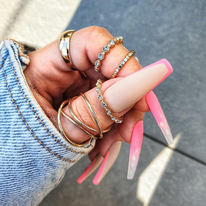 Juicy neon pink coffin nails with French and ombre style, partially transparent tips, perfect for vibrant summer and spring vibes by Nail Room Studio