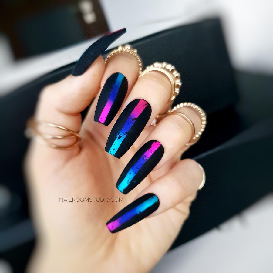 Long coffin nails in black, with matte finish and chic chrome accents in pink and blue by Nail Room Studio