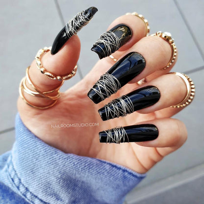 Nail Room Studio long black coffin nails wrapped with silver metal wire, giving a hard rock witchy vibe, ideal for Halloween and gothic-inspired looks, buy custom nails