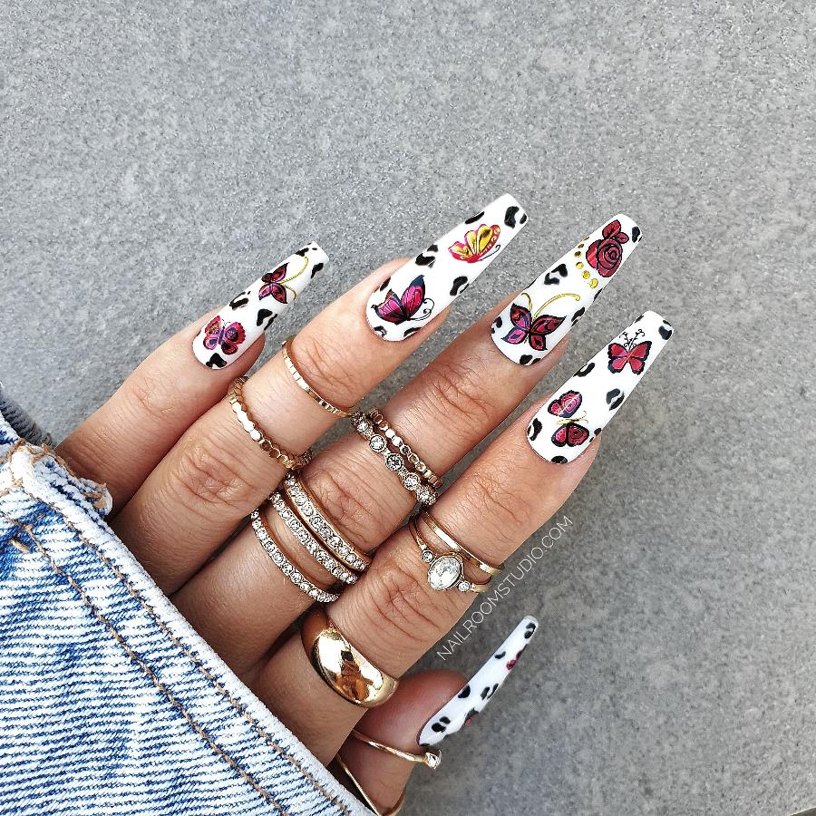 Expensive look white nails showcasing red floral and butterfly design, perfect for a romantic look, date false nails set from Nail Room Studio