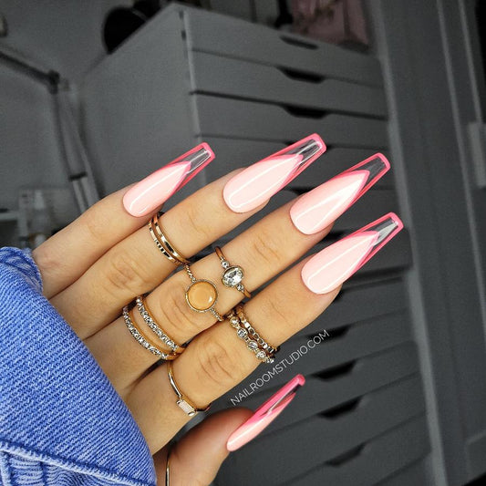 Modern French design with vibrant pink nail bed, clear transparent tips, and a neon pink frame, ideal for matching nails on both hands and toes by Nail Room Studio
