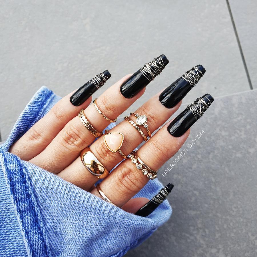 Nail Room Studio long black sculpted coffin nails with silver metal wire wrapping, perfect for a gothic witchy look, nails wrapped with silver wire, great for Halloween mortal theme, and Comic Con events