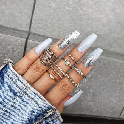 Natural-looking grey wedding nails in long coffin shape with subtle silver chrome accents, crafted for bridal elegance from Nail Room Studio