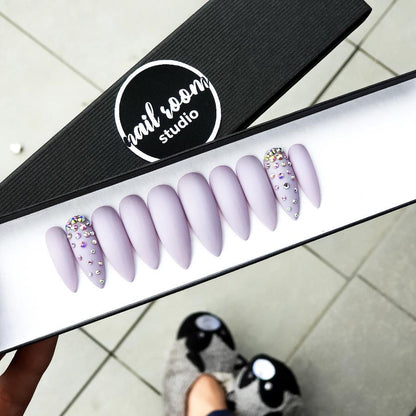 Long lilac stiletto nails with Swarovski crystals and matte finish from Nail Room Studio