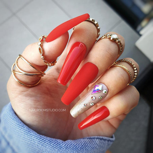 Nail Room Studio elegant red nails with a glossy matte finish and Swarovski crystals, perfect for creating a sophisticated look for both hands and feet, ideal for special occasions