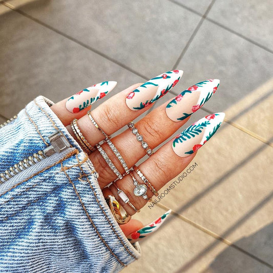 Elegant French nails fashion in India, pressons with delicate floral and leaf designs, creating a fresh and natural look by Nail Room Studio