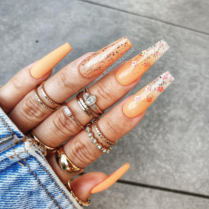 Bright orange coffin nails with glossy and matte chrome glitter, ombre effect with milky tips, fresh and summer-ready, with matching toes option by Nail Room Studio