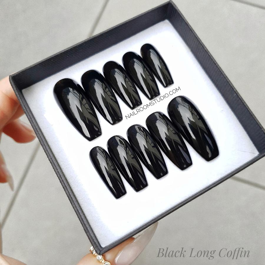 Glossy black classic nails in long coffin shape, elegantly presented in a monochromatic exclusive black and white box from Nail Room Studio