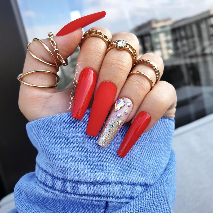 Nail Room Studio glossy matte red nails in long coffin shape, one nail decorated with Swarovski crystals, perfect for a chic and elegant look, available for both hands and feet, mix and match manicure and pedicure