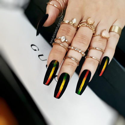 Gothic long coffin black nails with matte finish and African-inspired chrome accents by Nail Room Studio