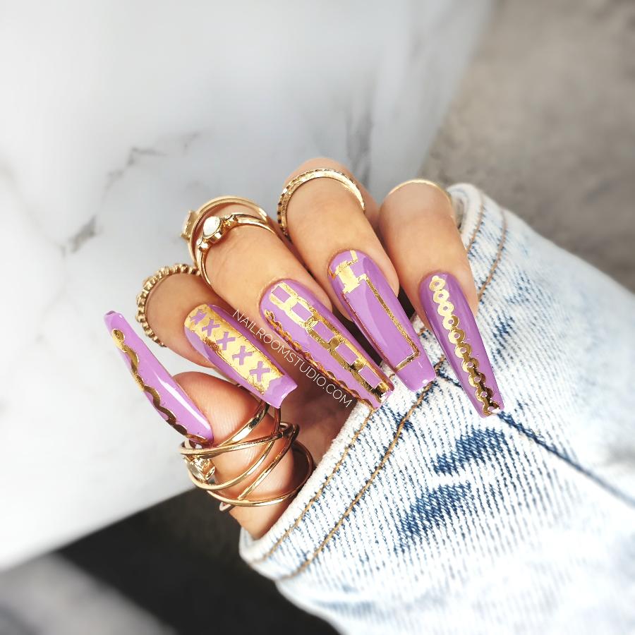 Stylish purple lilac extra-long coffin nails by Nail Room Studio with real gold crown nail tattoos, available as press-ons for hands and toes pedicure