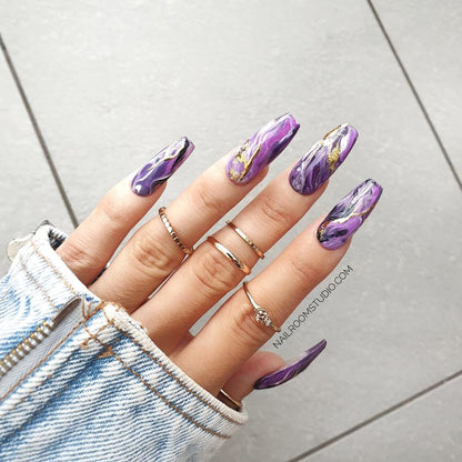 Long coffin nails in lilac, purple, and pink shades with a unique hand-painted marble design, perfect for both hand tips and toe tips, featuring a combination of plum, violet, and pink tones