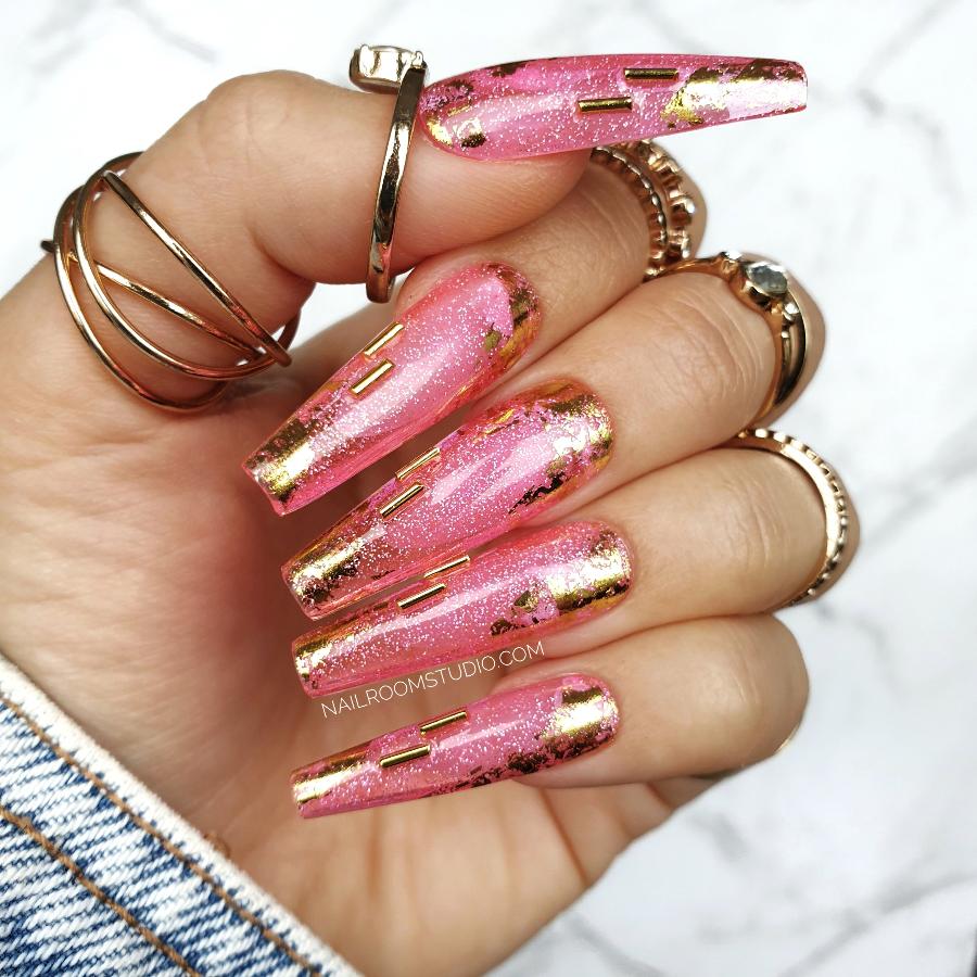 Nail Room Studio pink jelly nails with sparkle glitter and gold metallic charms, giving an exclusive vibrant look for hands and toes, custom nails online