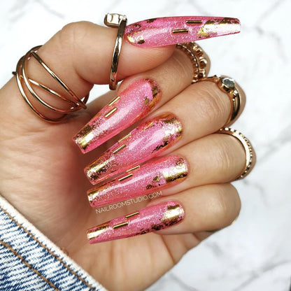 Nail Room Studio pink jelly nails with sparkle glitter and gold metallic charms, giving an exclusive vibrant look for hands and toes, custom nails online