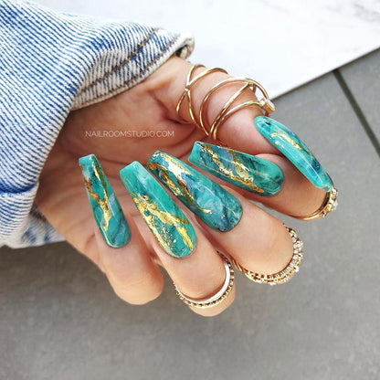 Long coffin-shaped autumn nails by Nail Room Studio in green shades with marble effect, gold chrome, and water painting details, for toes and hands