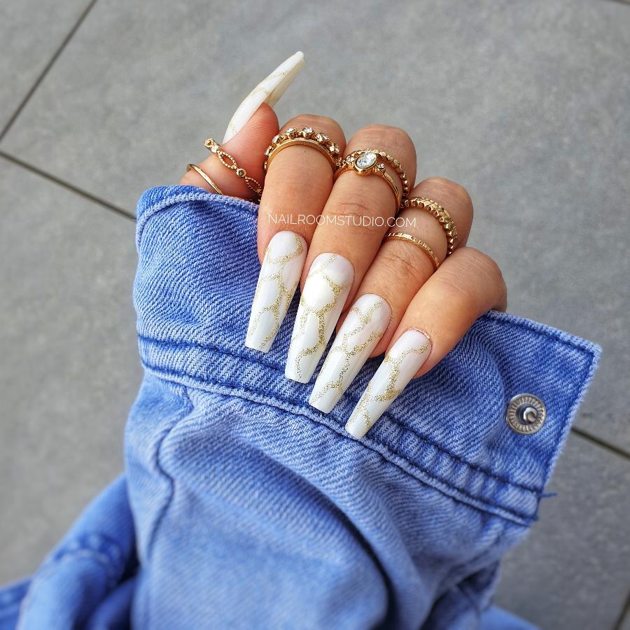 Nail Room Studio milky white nails with gold marble and glitter accents, perfect for a chic and sophisticated style, customizable for both hands and feet, available in matching manicure and pedicure sets