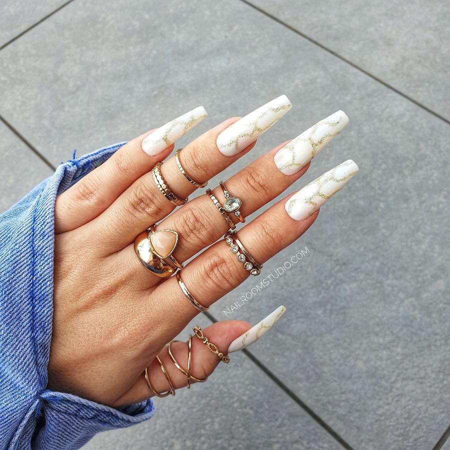 Nail Room Studio milky white nails with marble design and gold glitter accents, ideal for a classy and sophisticated look, perfect for both hands and feet, customizable matching manicure and pedicure sets with prep kit and glue