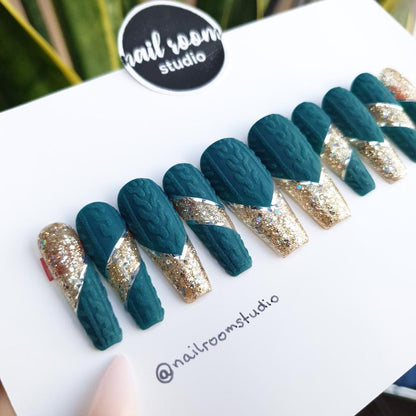 Alt: Sweater weather nails with 3D hand-painted designs, matte dark green finish with gold glitter accents, perfect for winter and Christmas, easy-to-apply press-on nails made by Nail Room Studio