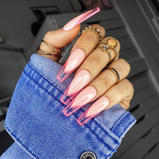 Neon pink framed french nails with a vibrant pink bed and clear transparent tips, stylish and fresh for both manicures and pedicures by Nail Room Studio