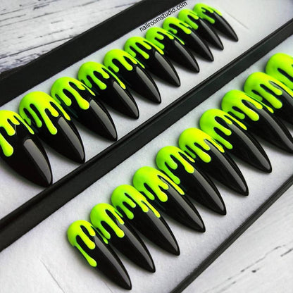 Halloween-inspired black and neon green slime nails, combining glossy and matte finishes made by Nail Room Studio