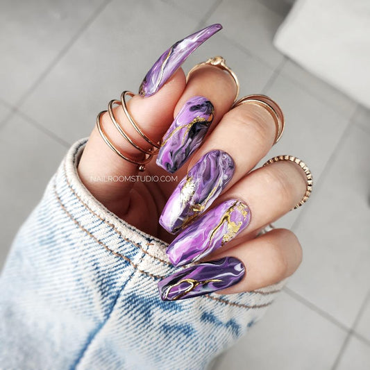 Long coffin press-on nails in lilac, purple, and pink shades with hand-painted marble design, ideal for both hands and toes, featuring a mix of plum, violet, and pink colors for a unique and vibrant look