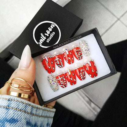 Medium Length coffin nails with a red bandana design and Swarovski silver opal crystals, featuring unique hand-painted patterns by Nail Room Studio