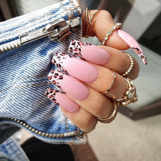 Delightful pink nails in kawaii fashion, showcasing unique leopard designs for a flirty and fashionable touch by Nail Room Studio