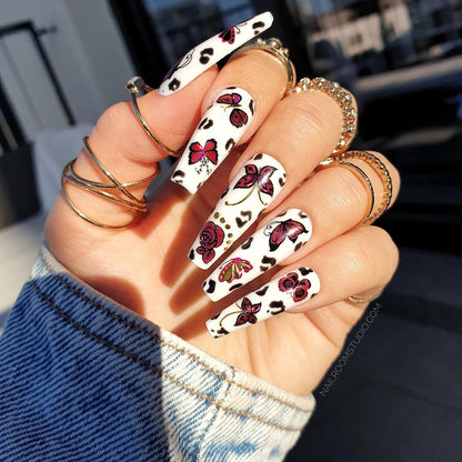 Stylish white nails with red flowers, gold chrome accents and butterfly accents, great for manicure at home. Nail design on toes, false nails set from Nail Room Studio