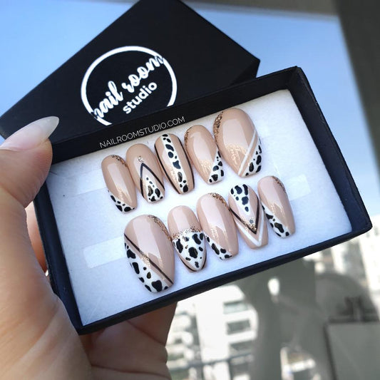 Elegant nude short coffin nails by Nail Room Studio featuring modern French style with Dalmatian spots, available as press-ons for hand hands, One Hundred and One Dalmatians press ons