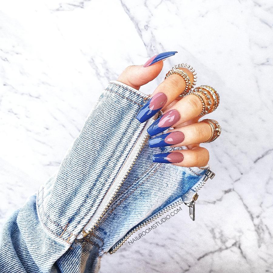 Elegant navy blue nails with refined natural French tips, for a polished and stylish look by Nail Room Studio