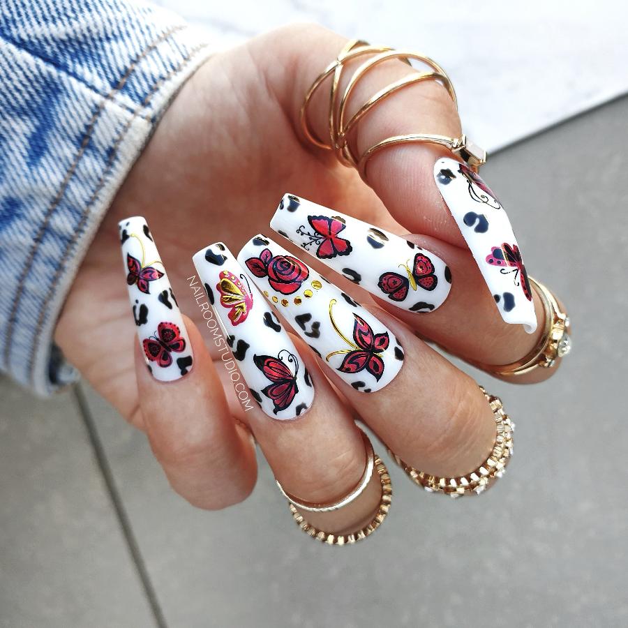 Elegant white nails featuring red floral patterns, ideal for weddings and special events, false nails set from Nail Room Studio