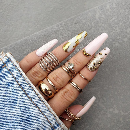 Long coffin-shaped Press-On nails in a glossy pink finish, adorned with sparkling gold chrome and crystals